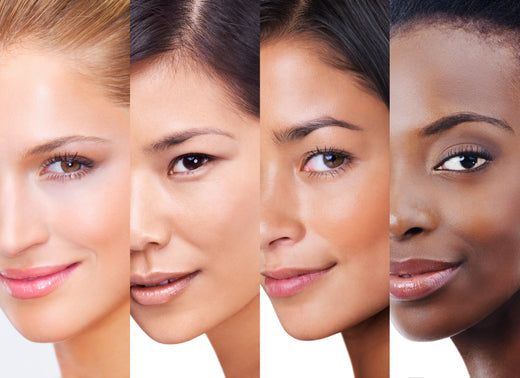 4 women from different ethnicities, with clean & radiant skin, smiling at the camera 