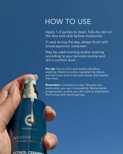 A hand holds a blue Elizabeth Goudier Wonder Retinol Ceramide pump bottle against a clear blue sky background, with white text instructions on the right side of the image.